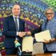 From the right is Mr. Niloy Banerjee UNDP Ghanas Resident Representative exchanging handshake with Mr. Jakob Linulf Ambassador of Denmark to Ghana 80x80